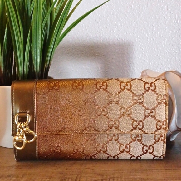 Gucci Handbags - *SOLD* New Gucci Canvas GG gold gradient Continental long wallet with charms